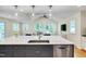 Kitchen island featuring granite countertops and stainless steel faucet at 823 Churchill Dr, Chapel Hill, NC 27517