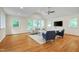 Inviting living room with large windows and comfortable seating arrangement at 823 Churchill Dr, Chapel Hill, NC 27517