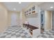Cozy mudroom with built-in bench, storage cubbies, and open access to the bathroom at 823 Churchill Dr, Chapel Hill, NC 27517