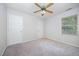 This bedroom has neutral colors and a ceiling fan at 84 Sycamore Lake Rd, Siler City, NC 27344