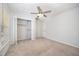 This bedroom has neutral colors and an open closet at 84 Sycamore Lake Rd, Siler City, NC 27344