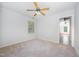 This bedroom has neutral colors and a window at 84 Sycamore Lake Rd, Siler City, NC 27344