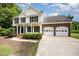 Traditional two-story house with black shutters and an attached two-car garage at 84 Sycamore Lake Rd, Siler City, NC 27344