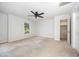 Spacious main bedroom features a ceiling fan, closet, and bright windows at 84 Sycamore Lake Rd, Siler City, NC 27344