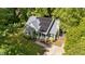 Aerial view of a home with solar panels, manicured landscaping, and a welcoming entrance at 909 Alderleaf Dr, Fuquay Varina, NC 27526