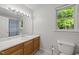 Traditional bathroom with marble countertops, wood cabinets, tiled floors, and a shower/tub combo at 909 Alderleaf Dr, Fuquay Varina, NC 27526