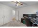 Neutral bedroom with carpeting, a ceiling fan, and double closets at 909 Alderleaf Dr, Fuquay Varina, NC 27526