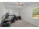 Neutral bedroom with two windows, and a ceiling fan at 909 Alderleaf Dr, Fuquay Varina, NC 27526