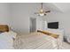 Bedroom features ceiling fan, carpet, and dresser at 909 Alderleaf Dr, Fuquay Varina, NC 27526