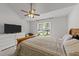 Bedroom features ceiling fan, carpet, and nice natural light at 909 Alderleaf Dr, Fuquay Varina, NC 27526