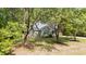 Charming home with a well-maintained lawn and mature trees, enhancing curb appeal at 909 Alderleaf Dr, Fuquay Varina, NC 27526