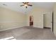 Bedroom features a ceiling fan and an en-suite bathroom at 924 Carolina Bell Rd, Apex, NC 27502