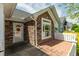 Close-up featuring an entrance framed by attractive stone work and a white picket fence at 924 Carolina Bell Rd, Apex, NC 27502