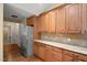 Kitchen with stainless steel appliances, granite countertops, and wooden cabinets at 924 Carolina Bell Rd, Apex, NC 27502