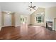 Spacious living room with hardwood floors, fireplace, and view to sunroom at 924 Carolina Bell Rd, Apex, NC 27502
