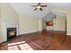 Open-concept living area with hardwood floors, fireplace, and easy access to the kitchen at 924 Carolina Bell Rd, Apex, NC 27502