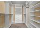 Walk-in closet with built-in shelving and drawers at 924 Carolina Bell Rd, Apex, NC 27502