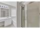 Clean, white bathroom with a shower, tub, white vanity, and a well lit mirror at 10 Marsh Landing Ct, Durham, NC 27703