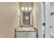 Bathroom featuring vanity with granite countertop and updated lighting at 10 Marsh Landing Ct, Durham, NC 27703
