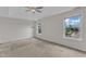 Bright, airy bedroom with a trey ceiling, ceiling fan, and two scenic view windows at 10 Marsh Landing Ct, Durham, NC 27703