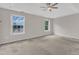 Spacious bedroom featuring a ceiling fan and large windows with scenic outdoor views at 10 Marsh Landing Ct, Durham, NC 27703