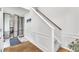 Bright entryway featuring fresh white walls and a staircase with wooden handrail at 10 Marsh Landing Ct, Durham, NC 27703