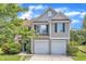 Charming two-story home with a two car garage and manicured lawn at 10 Marsh Landing Ct, Durham, NC 27703