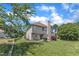 Exterior of home with large yard and trees at 10 Marsh Landing Ct, Durham, NC 27703