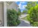 A stone path leads to the house with a walkway next to a green yard at 10 Marsh Landing Ct, Durham, NC 27703