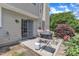 Back patio area with an outdoor grill and sitting area with a sliding glass door at 10 Marsh Landing Ct, Durham, NC 27703