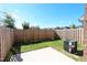 Fenced backyard with a small patio and grassy area, perfect for outdoor enjoyment at 1033 Talisker Way # 16, Burlington, NC 27215