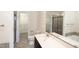Bright bathroom with a large vanity, mirror, separate shower and soaking tub at 1033 Talisker Way # 16, Burlington, NC 27215