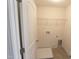 Practical laundry room with appliances hookups and wire shelving for easy storage at 1033 Talisker Way # 16, Burlington, NC 27215