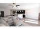 Open-concept living room flows into a kitchen with sleek, dark cabinets and stainless steel appliances at 1033 Talisker Way # 16, Burlington, NC 27215