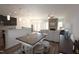 Open-concept living space with a dining area, fireplace, and views of the kitchen and backyard at 1033 Talisker Way # 16, Burlington, NC 27215
