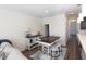 Open-concept living space with a dining area, fireplace, and views of the kitchen and backyard at 1033 Talisker Way # 16, Burlington, NC 27215