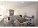Open-concept living space with a dining area, fireplace, and views of the kitchen and backyard at 1033 Talisker Way # 16, Burlington, NC 27215