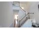 Grand staircase with white railings, stained wood accents, and soaring ceilings adds a sense of luxury at 1033 Talisker Way # 16, Burlington, NC 27215