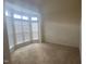 Bedroom features plush carpet, large windows with blinds, and neutral-toned walls at 104 Elmsford St, Durham, NC 27703