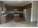 Well-equipped kitchen with stainless steel appliances, granite counters and a convenient center island at 104 Elmsford St, Durham, NC 27703