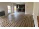 Spacious living room with fireplace and an open floor plan that leads into the kitchen at 104 Elmsford St, Durham, NC 27703