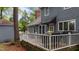 Outdoor deck with white railings, a black awning, and a gray grill at 1100 Cardinals Knob, Rocky Mount, NC 27804