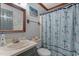 A charming bathroom with coastal-themed decor and blue anchor shower curtain at 1100 Cardinals Knob, Rocky Mount, NC 27804