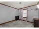 A small bedroom with gray walls, a small window, and dark wooden trim at 1100 Cardinals Knob, Rocky Mount, NC 27804