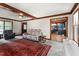 Comfortable living room with a brick fireplace and an open view into the blue kitchen at 1100 Cardinals Knob, Rocky Mount, NC 27804