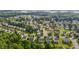 Aerial view of a neighborhood with mature trees and green lawns at 1301 Torrey Pines Ct, Mebane, NC 27302