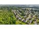 Aerial view of a community with tree-lined streets and well-maintained lawns at 1301 Torrey Pines Ct, Mebane, NC 27302
