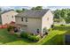 Backyard featuring a deck with pergola, grill, lush landscaping, and a spacious lawn for outdoor enjoyment at 1301 Torrey Pines Ct, Mebane, NC 27302