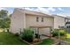 Backyard with a wood pergola, built in wood seating and green grass at 1301 Torrey Pines Ct, Mebane, NC 27302