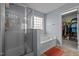 Relaxing bathroom with separate glass enclosed shower and soaking tub, perfect for unwinding at 1301 Torrey Pines Ct, Mebane, NC 27302